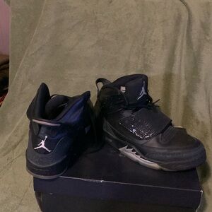 Black and gray air Jordan with lace protective flap